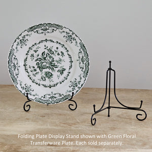The Folding Plate Display Stand is a decorative plate holder made of smooth black iron material. The holder comes in an A-frame shape, able to fold together, for easy storage. Pair this holder with a decorative plate for a year-round display on any shelf, tabletop, or other flat surface. Holds dishes 6-8" in diameter.