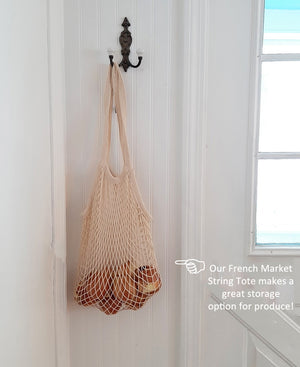 Step out in style, around town or around the world, with a reusable bag that's fashionable, functional, and durable. This seemingly small bag stretches and expands to accommodate almost anything you put in it, from fruits and veggies, to breads and flowers, and it'll last years and years. The French Market String Tote with Long Handle is perfect for going to your grocer or farmer's market.