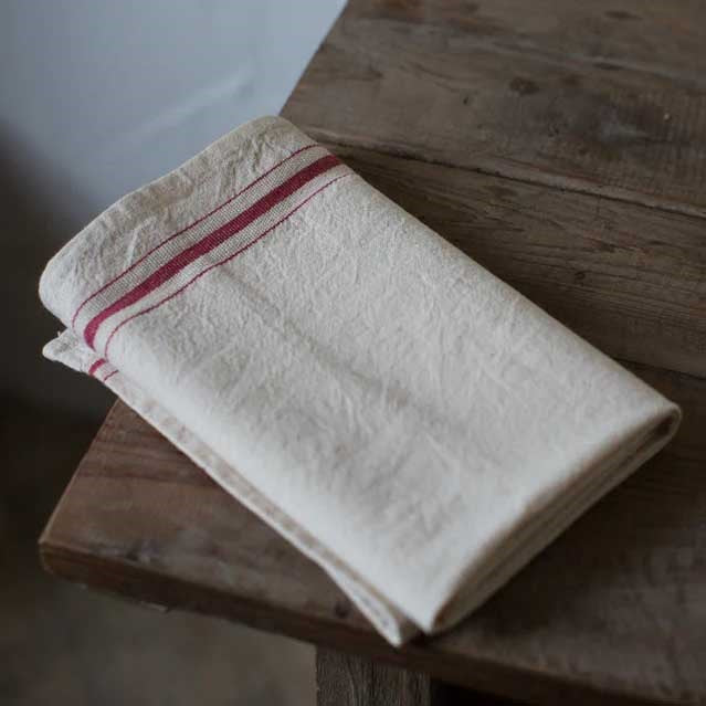 You'll love the rustic French Country look of this French Bistro Red Stripe Kitchen Towels. Classic red stripes against a warm off-white background with tan specks bring a bit of vintage style to your farm kitchen chores. It's generous and unique size adds extra charm and versatility. Machine wash gentle, line dry. Linen/cotton blend. 17" x 36"