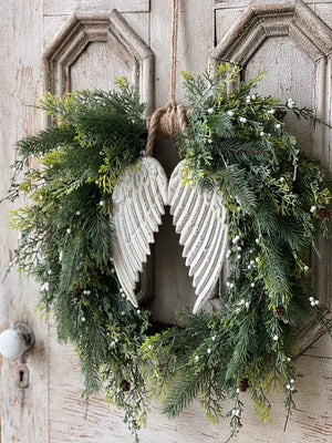 These Hanging Embossed Metal Wings are crafted with aged, embossed metal, giving them a vintage and elegant feel. The versatility allows for endless decorating options, whether they're nestled in a wreath or displayed on its own. Wreath not included.