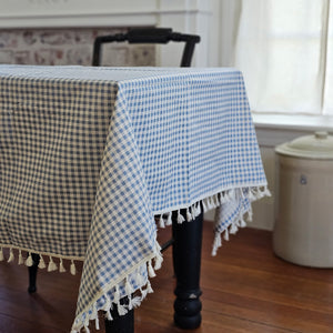 Add country charm to any occasion with our French Blue Gingham Tablecloth with Tassel Trim. This light blue gingham tablecloth has a casual cottage feel and is perfect for indoor or outdoor dining. Cotton and Polyester Blend. Machine wash. 55" x 70"