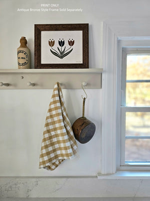 The simplicity and boldness of this Scandinavian Style Tulip Art Print lends instant charm to any room. Features three tulips in rustic shades of mustard, navy and burnt orange. Professionally printed on high quality archival fine art paper that has a oatmeal grain flecks with archival inks. Listing is for the art print only, frame not included. 10 x 8 Made in the USA