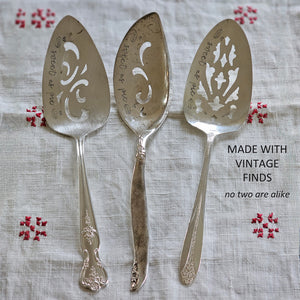 So sweet! So vintage! Darling pie servers are hand-stamped "Sweet as Pie". Made from vintage silver plate servers, each item will be unique. Due to their vintage nature, flatware pieces may show signs of age and gentle use. No two are alike and the handle will vary. The pie servers are all lovingly collected by the artist from flea markets and antique shops and then hand-stamped with care. Includes one pie server. Each approximately 8.25"L. Made in the USA. 