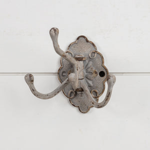 Our Warm Grey Swivel Wall Hook brings vintage style to any room. Perfect for hanging dishtowels, scarves, necklaces and more, this antique reproduction features three hooks that swivel. Add historic charm to your farmhouse entryway, kitchen or bath with this wall-mounted hook. 2.75"L x 5.25"Deep x 4.25"H