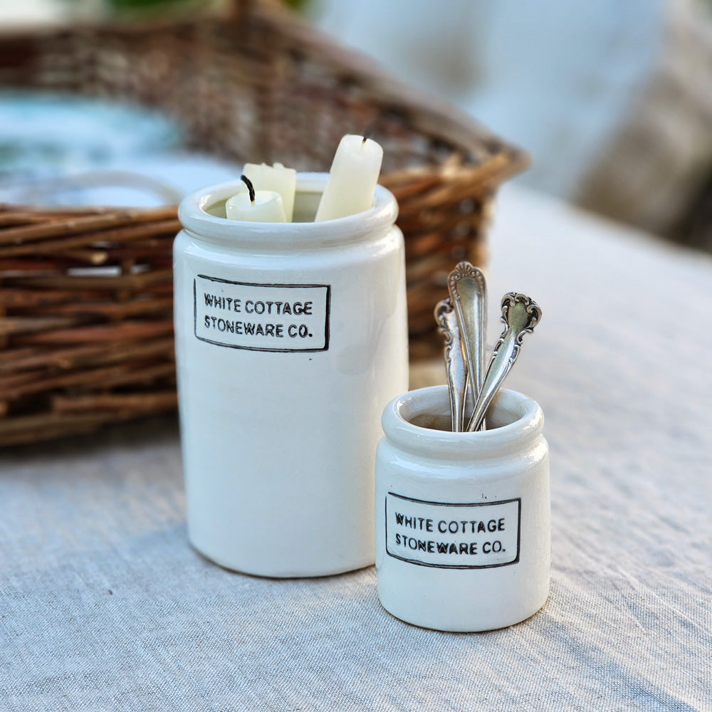 Inspired by vintage jam jars, these sweet mini crocks lend a sweet touch to white farmhouse decor. The White Cottage Stoneware Jam Jars features "White Cottage Stoneware Co" embossed on the front and are available in two sizes. Mini: 2" Diam x 2.5"H, Half Pint: 3" Diam x 4.5"H