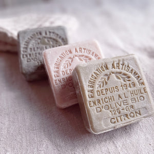 These authentic 100% natural and organic french soaps are made with pure olive oil. The set includes one lemon, one honey and one clay soaps. The delicate scents fill the air with fresh, clean aromas as you soothe and soften skin with nurturing olive oil. Each soap is stamped for added beauty. Fill a jar and create a beautiful accent for your bath. Set of three. Each 4.41oz