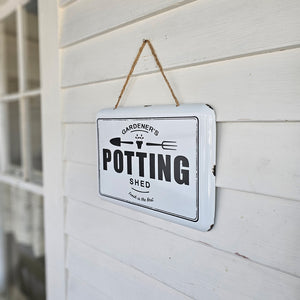 Our vintage style Gardener's Potting Shed Sign makes the perfect gift for your friends with a flair for flowers. The white enamel style tin sign has an aged appearance, adding old-fashioned charm to your potting shed, a front porch, or any room. Includes rope for easy hanging. 12"L x 8.5"H
