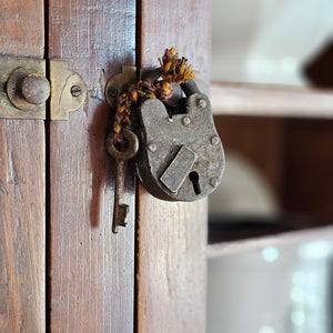 Our Antique Lock and Key adds the perfect vintage touch. Made of metal, these authentic antique lock and keys are each one-of-a-kind, so styles will vary. Pieces are attached via knotted multicolored rope for added appeal. Hang from an old cupboard door or use to create vintage vignettes. Dimensions are approximately 1.75"L x .50"W x 3.5"H  Item not eligible for return
