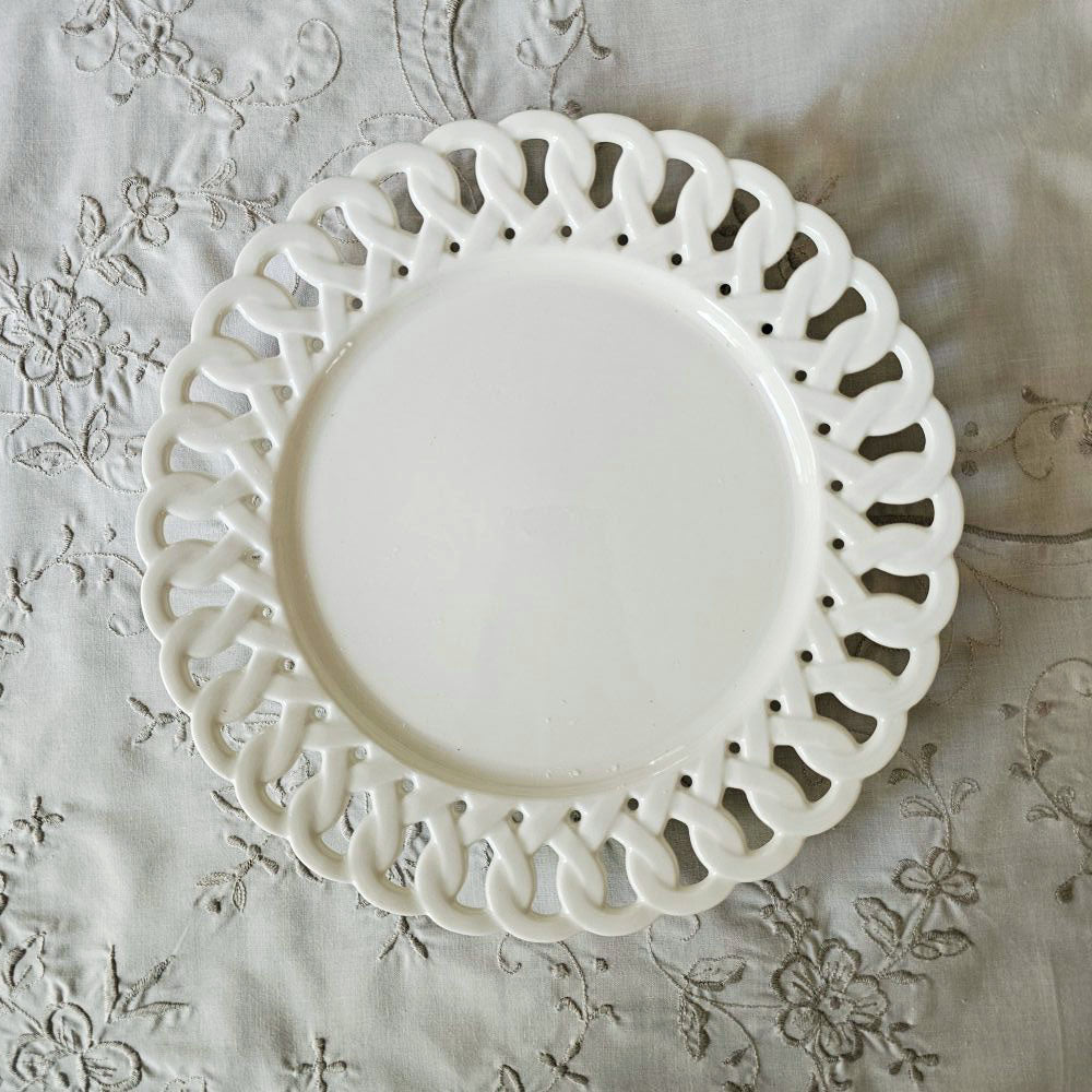Add a romantic cottage touch with our Antique White Keepsake Dessert Plate with Lattice Trim. Made of fine porcelain, with delicate cut details along the rim, this plate brings a dreamy elegance to any occasion. The antique white glaze fits well with creamware collections. 8" 