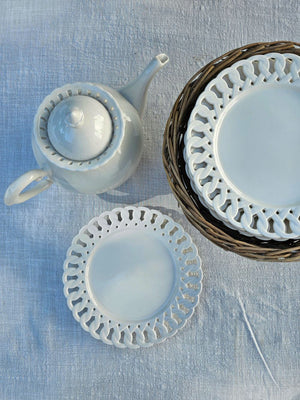 Add a romantic cottage touch with our Antique White Keepsake Dessert Plate with Lattice Trim. Made of fine porcelain, with delicate cut details along the rim, this plate brings a dreamy elegance to any occasion. The antique white glaze fits well with creamware collections. 8" 