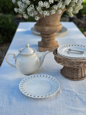 Add a romantic cottage touch with our Antique White Keepsake Dessert Plate with Lattice Trim. Made of fine porcelain, with delicate cut details along the rim, this plate brings a dreamy elegance to any occasion. The antique white glaze fits well with creamware collections. 8" 