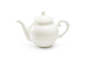 Add a romantic cottage touch with our Antique White Keepsake Teapot with Pierced Lace Trim. Made of fine porcelain, with delicate cut details along the rim, this teapot brings a dreamy elegance to any occasion. The antique white glaze fits well with creamware collections. 