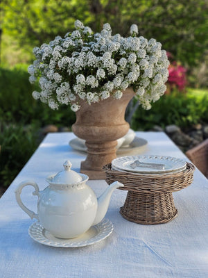 Add a romantic cottage touch with our Antique White Keepsake Teapot with Pierced Lace Trim. Made of fine porcelain, with delicate cut details along the rim, this teapot brings a dreamy elegance to any occasion. The antique white glaze fits well with creamware collections. 