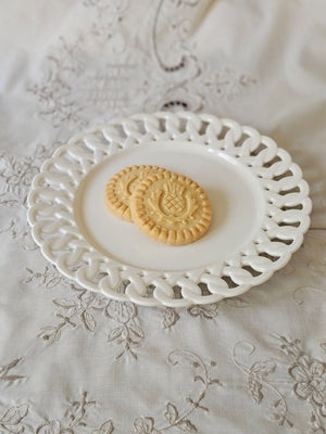 Add a romantic cottage touch with our Antique White Keepsake Dessert Plate with Lattice Trim. Made of fine porcelain, with delicate cut details along the rim, this plate brings a dreamy elegance to any occasion. The antique white glaze fits well with creamware collections. Includes one plate.