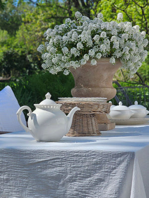 Add a romantic cottage touch with our Antique White Keepsake Teapot with Pierced Lace Trim. Made of fine porcelain, with delicate cut details along the rim, this teapot brings a dreamy elegance to any occasion. The antique white glaze fits well with creamware collections. 