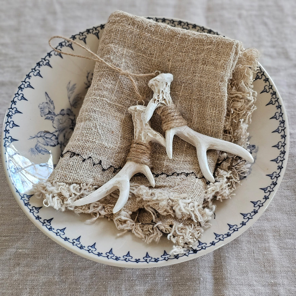 https://farmhousewares.com/cdn/shop/files/Antler-Ornament-with-Blue-Leaf-Transferware-SQ_1000x.jpg?v=1700491970