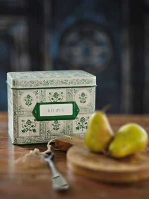 Keep treasured family recipes close at hand with the Artichoke Recipe Box. This vintage style tin recipe box brings cottage charm to your kitchen with its retro green artichoke design set against a creamy ivory background. It includes 24 beautifully illustrated recipe cards and coordinating recipe dividers. It holds up to 200 recipe cards. 6.5"L x 4.6'W x 5"H