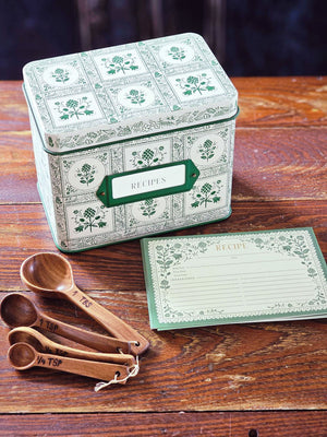 Keep treasured family recipes close at hand with the Artichoke Recipe Box. This vintage style tin recipe box brings cottage charm to your kitchen with its retro green artichoke design set against a creamy ivory background. It includes 24 beautifully illustrated recipe cards and coordinating recipe dividers. It holds up to 200 recipe cards. 6.5"L x 4.6'W x 5"H