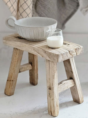 The Baby Elm Wood Stool is crafted from mid-1800's elm wood, a wood that is strong and long lasting and made without using nails or screws. These primitive pieces were created for pure function. Each features a perfectly imperfect rough-cut look with cracks and crevices that give this stool old-world charm and timeworn texture. Place accents such as vases, jars, candles or use to display small plants.