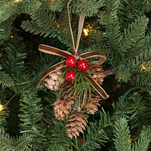 Add a touch of old-fashioned charm to your holiday decor with the Hanging Birchcones and Berries Ornament. Real birchcones beautifully contrast with faux red berries and a pine sprig adorned with a luxurious gold velvet bow. It's the perfect gift topper for a sophisticated and elegant touch. 2.5"W x 3"L