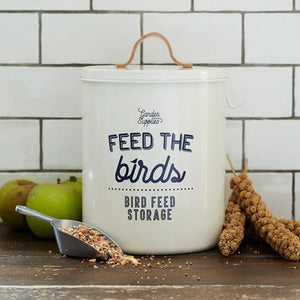 The Bird Food Storage Bin offers a touch of style to your home and garden while providing a practical solution for feeding your feathered friends. Its seamless steel construction and tough powder coating ensure durability, while the leather handle and on-trend typography add a unique design flair. Complete with a seed scoop and hanging hook for convenience. The vintage enamelware style makes a great addition to any potting shed, mudroom or any place you store your bird vittles.