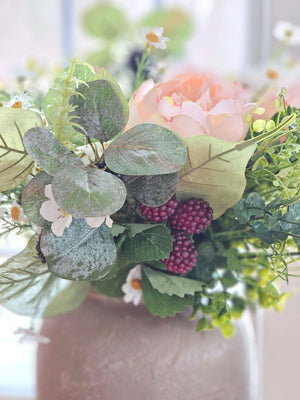 The Blackberry Bramble and Eucalyptus Pick adds instant cottage charm to any basket or bouquet. Infused with a summer in the countryside vibe, this sweet pick features lifelike blackberries, greenery and small white blackberry flowers. Some berries are dark, while others are lighter shades of raspberry color. A sprig of eucalyptus sits in the center. Add a down-to-earth and timeless look to your mantles, baskets and more. 14"H