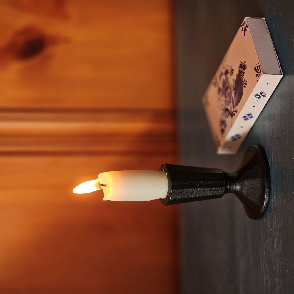 The understated elegance of our Blacksmith Taper Candle Holder lends an historic charm to any room. This artfully crafted black metal piece captures the essence of traditional metalwork with its hand-forged aesthetic, bringing timeless character to any space. The refined minimalist silhouette complements both contemporary and classic interiors, while its sturdy construction accommodates standard taper candles.