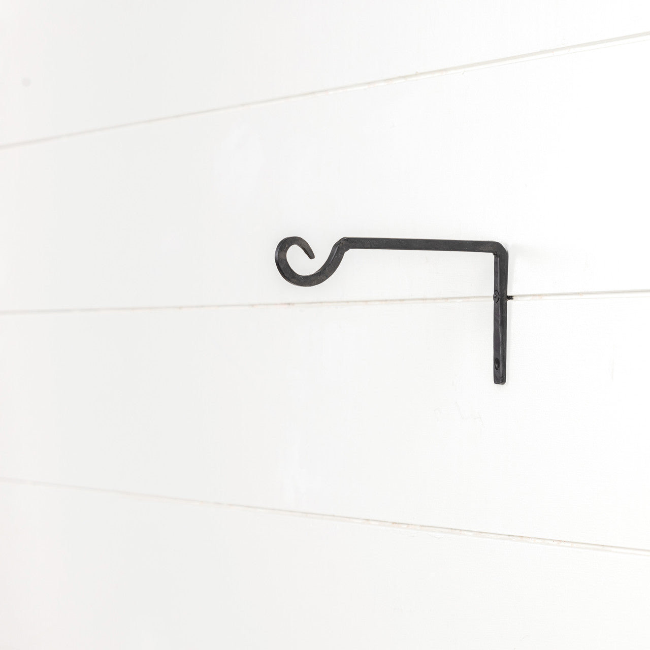 A unique and versatile take on the traditional wall hook, the Blacksmith Wall Hook will be your go-to hardware for hanging anything from terrariums to lanterns. 7.25"L x 4"H