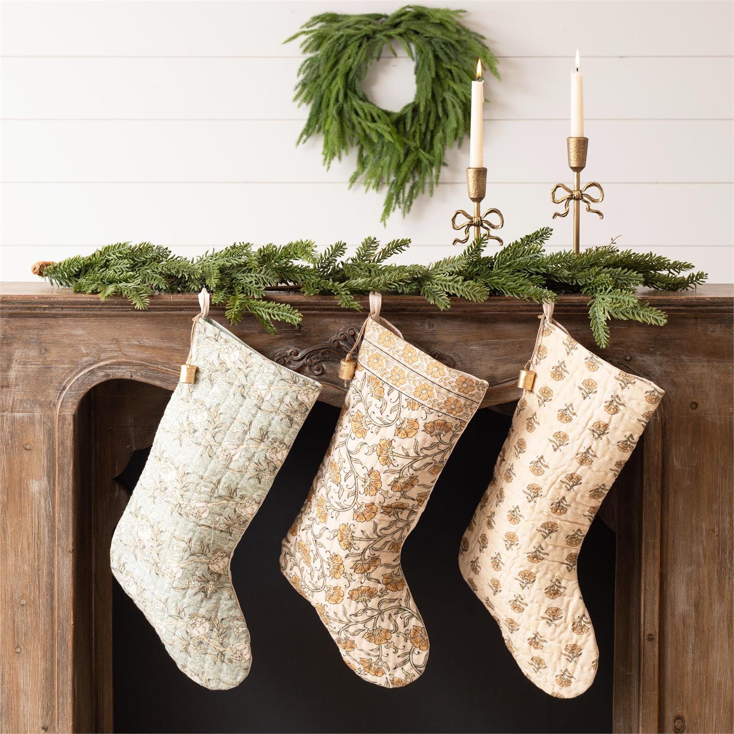 Elevate your holiday decor with timeless elegance through our Block Print Stockings with Bell, Set of Three. Each quilted stocking showcases a distinct block print design that harmonizes beautifully when displayed together, creating a curated, gallery-like aesthetic. Delicate golden bells adorning the hanging loops add a refined finishing touch.