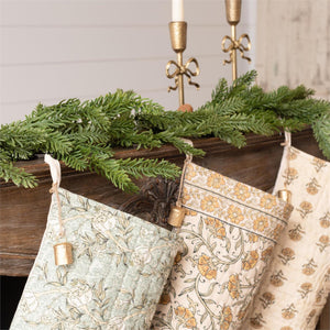 Elevate your holiday decor with timeless elegance through our Block Print Stockings with Bell, Set of Three. Each quilted stocking showcases a distinct block print design that harmonizes beautifully when displayed together, creating a curated, gallery-like aesthetic. Delicate golden bells adorning the hanging loops add a refined finishing touch.