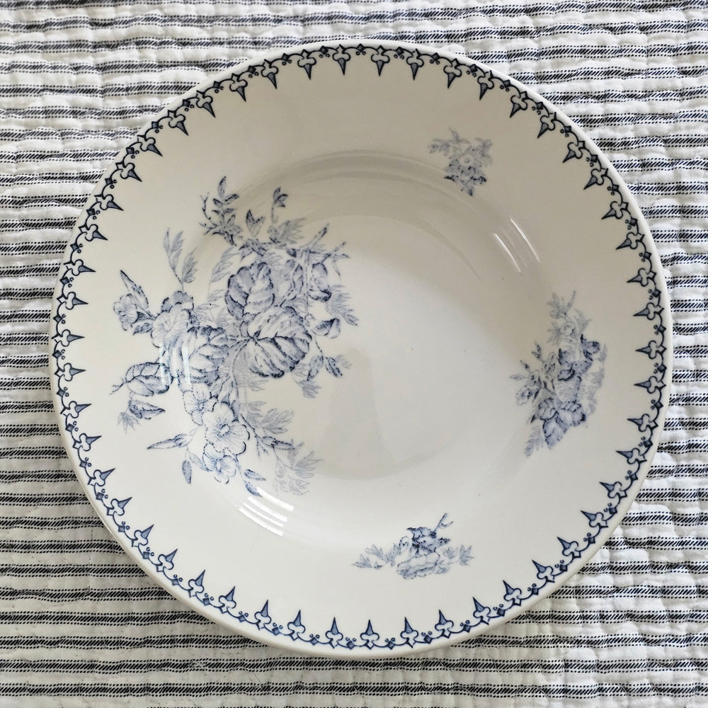 Inspired by antique transferware, our Blue Leaf Transferware Soup Bowl lends French country cottage style to any shelf, tabletop or dinnerware collection. A vintage classic, transferware has adorned the shelves of American farmhouses for centuries. The delicate floral pattern in vintage blue on an antique white background. Perfect for soups and salads. Food safe. Hand wash recommended. Includes one bowl. 8.96" Diam
