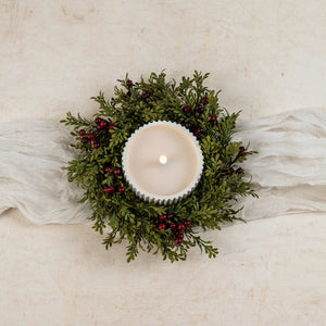  our small faux Boxwood and Berries Wreath and Candle Ring brings a fresh, earthy style to your farmhouse decor. Features faux green boxwood leafs and burgundy berries on a natural wood vine frame. Perfect for adding a fresh twist to pillar candle holders