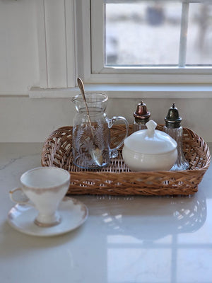 Our Braided Basket Tray offers quintessential country farmhouse style. This charming shallow wicker basket makes a beautiful presentation for farmhouse gatherings to hold napkins and utensils or add it to your home office for mail and so much more. Accessories not included. 14.5"L x 11.5”W x 3"H