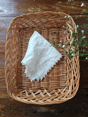 Our Braided Basket Tray offers quintessential country farmhouse style. This charming shallow wicker basket makes a beautiful presentation for farmhouse gatherings to hold napkins and utensils or add it to your home office for mail and so much more. Accessories not included. 14.5"L x 11.5”W x 3"H