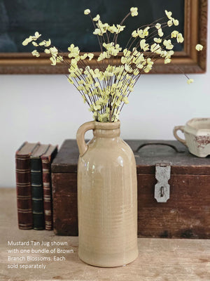 Our airy Brown Branch Blossom Spray, set of three, adds warm color and interest to your displays all year round. The wispy branch and delicate fabric blossoms lend easy country cottage charm. The sprays can be displayed alone for a simple country look or arranged into a bouquet. It easily fits into baskets, buckets, and milk cans and more.