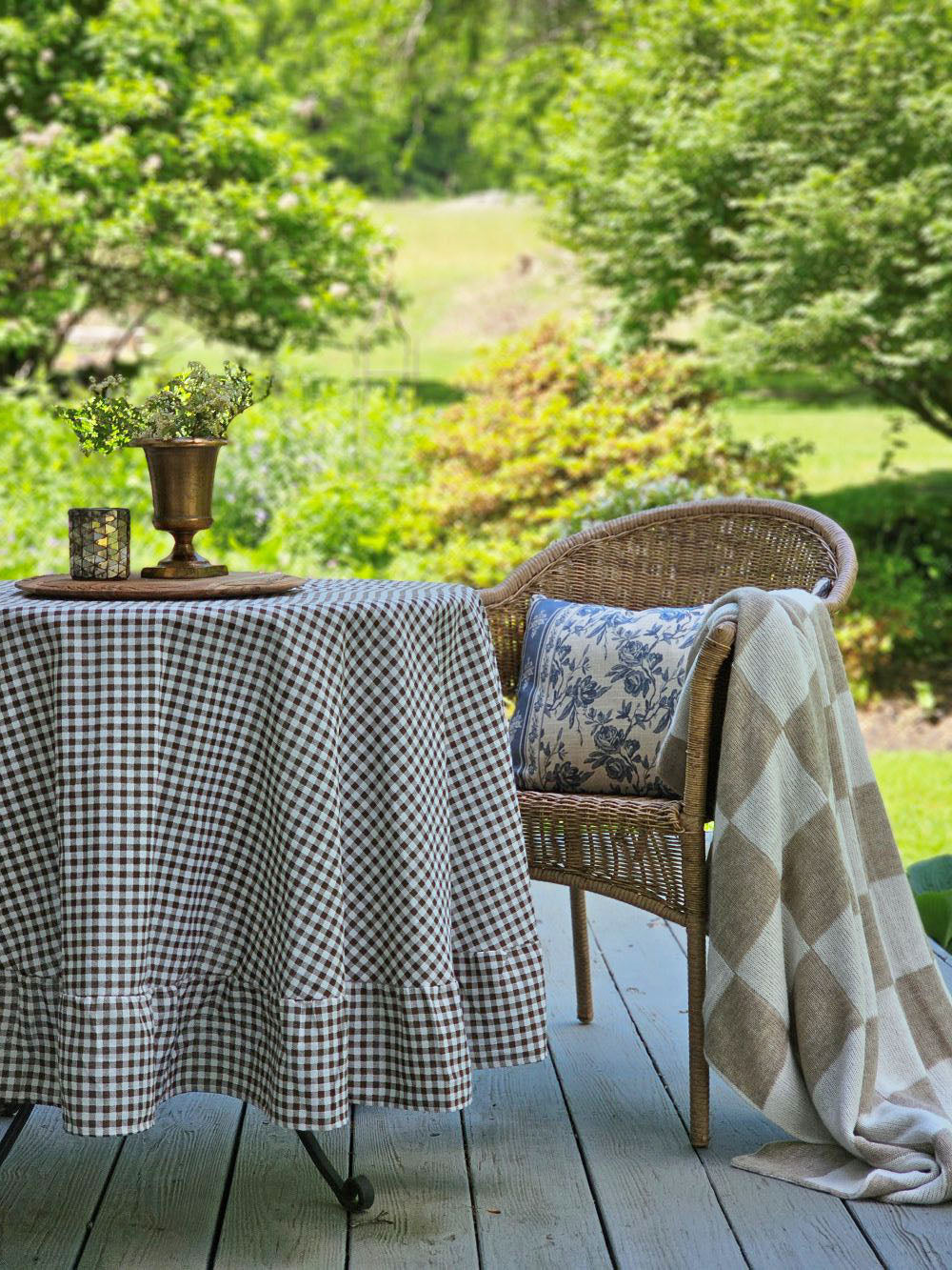 Brown and White Gingham and Ruffles Tablecloth with French Blue Floral Pillow, Knit Check Throw, Aged Bronze Gold Urn Vase