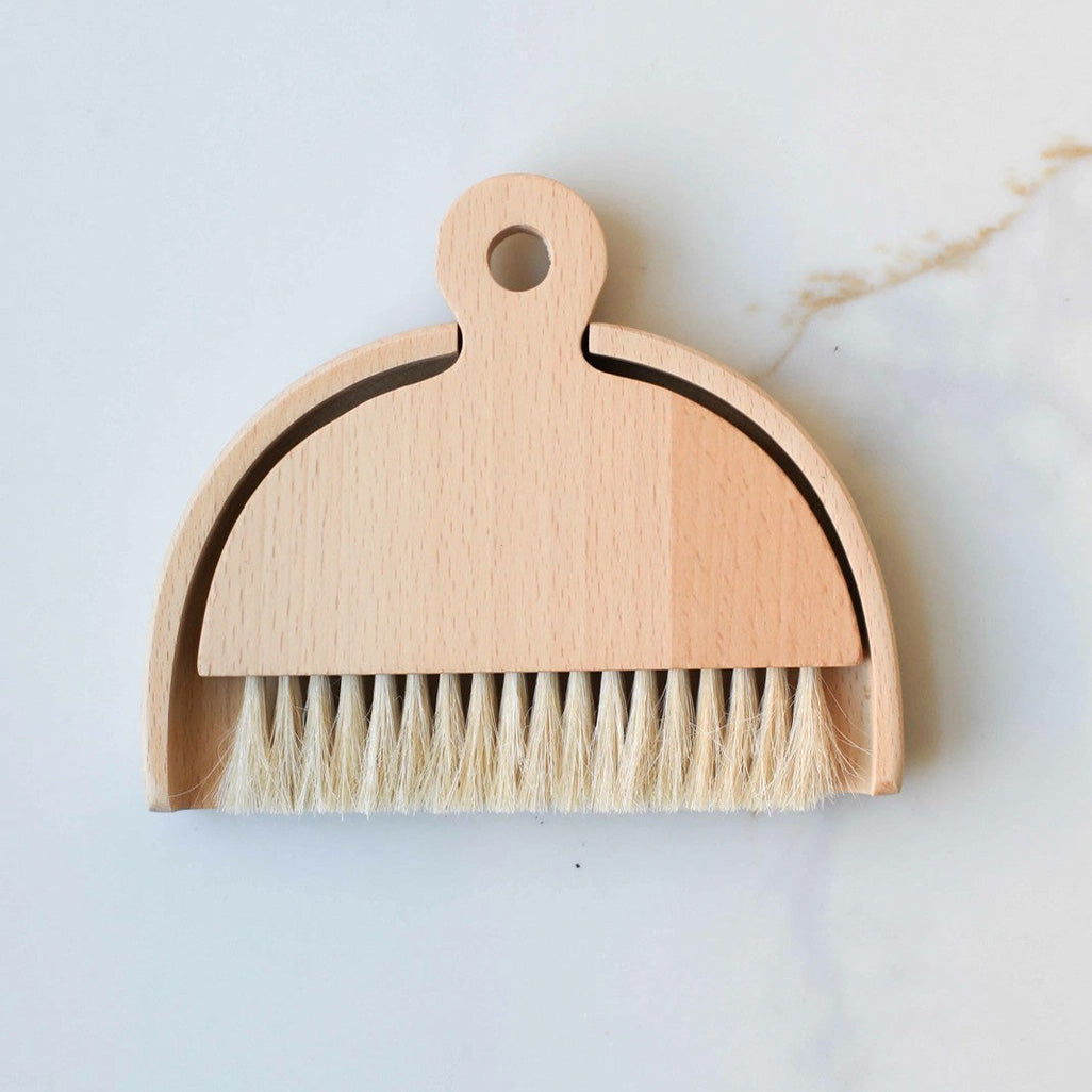 Whether you're cleaning up bread crumbs or keeping a craft room tidy, this mini dustpan and brush Butler's Table Sweeper is a must-have around the farmhouse. This set includes a wood dustpan and horsehair broom with wood handle. Keep your dining and work surfaces spotless with this compact yet powerful cleaning tool designed for effortless tidying. 5.7"L x 4.7"W