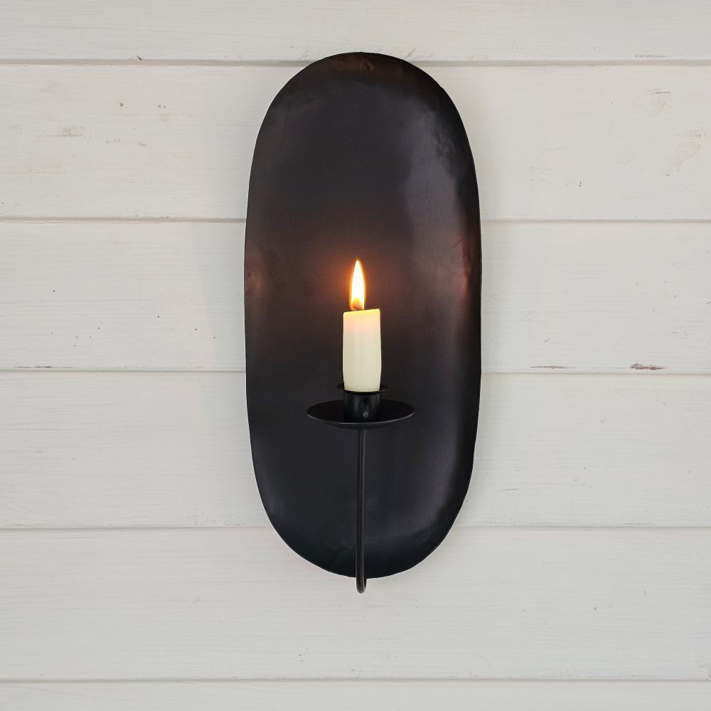 Our Camden Taper Candle Wall Sconce offers a charming colonial farmhouse feel. The wall sconce features a simple design that fits with both modern and rustic farmhouse styles. Made with black metal with a matte finish