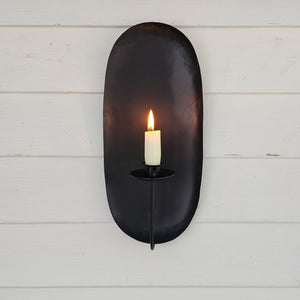 Our Camden Taper Candle Wall Sconce offers a charming colonial farmhouse feel. The wall sconce features a simple design that fits with both modern and rustic farmhouse styles. Made with black metal with a matte finish