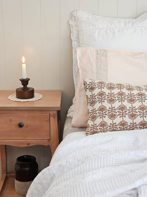 Scribner Taper Candle Holder with Camille Bolster Style Pillow and Vintage Style Crochet and Pleated edge pillowcase in peach 