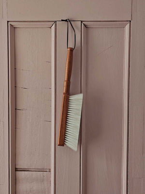 The Cashmere Wood Handled Cleaning Brush is perfect for removing dust and debris from sensitive fabrics or delicate objects. Made of 70% cashmere/wool this brush is plush and super soft with a vintage style wood handle and leather loop for hanging. Ideal for use on silk, wool, velvet, and other fine textiles as well as delicate objects such as keyboards. 