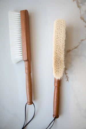 The Cashmere Wood Handled Cleaning Brush is perfect for removing dust and debris from sensitive fabrics or delicate objects. Made of 70% cashmere/wool this brush is plush and super soft with a vintage style wood handle and leather loop for hanging. Ideal for use on silk, wool, velvet, and other fine textiles as well as delicate objects such as keyboards. 