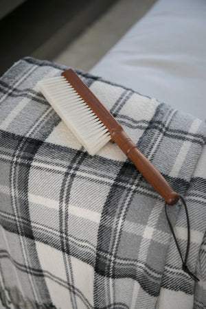 The Cashmere Wood Handled Cleaning Brush is perfect for removing dust and debris from sensitive fabrics or delicate objects. Made of 70% cashmere/wool this brush is plush and super soft with a vintage style wood handle and leather loop for hanging. Ideal for use on silk, wool, velvet, and other fine textiles as well as delicate objects such as keyboards. 