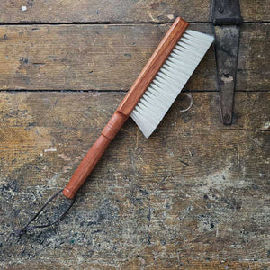 The Cashmere Wood Handled Cleaning Brush is perfect for removing dust and debris from sensitive fabrics or delicate objects. Made of 70% cashmere/wool this brush is plush and super soft with a vintage style wood handle and leather loop for hanging. Ideal for use on silk, wool, velvet, and other fine textiles as well as delicate objects such as keyboards. 