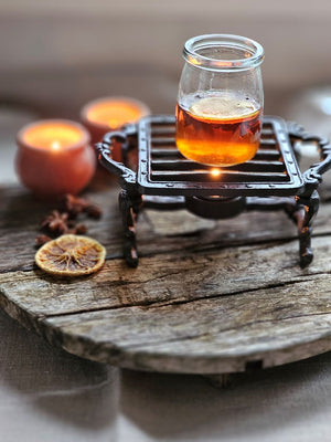 The Cast Iron Pot Warmer Trivet is perfect for adding an old-time touch with tons of practicality. This cast iron trivet is designed keep teapots and other small pots warm. It features a tea light candle holder to warm tea or pots of milk.