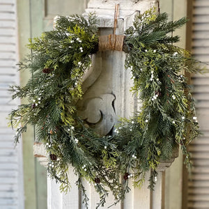 The White Berry and Cedar Wreath brings a quiet elegance to any room. Beautiful mixed greenery is interspersed with constellations of small white orbs and pine cones to create a collection perfect for season-long use. The twine wrap along the top adds a down-to-earth, rustic touch. 24"