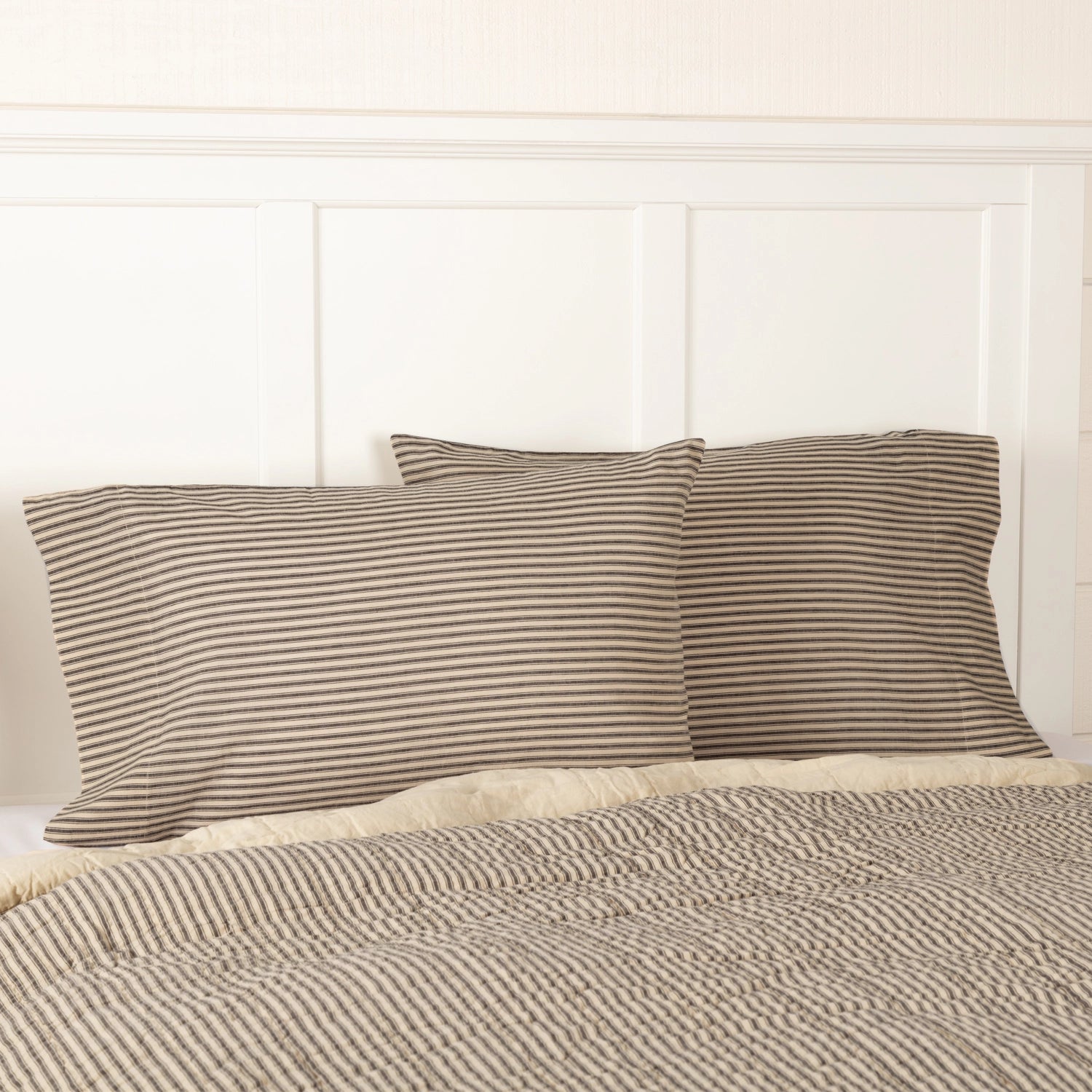 Whether you're creating a farmhouse style bedroom, a cozy cabin nook or a cottage guest room, our Charcoal Ticking Stripe Pillow Case Set offers vintage charm. This pillow case set features popular ticking stripes in charcoal along with a buttery oat stripe. Set of two. 100% Cotton.
