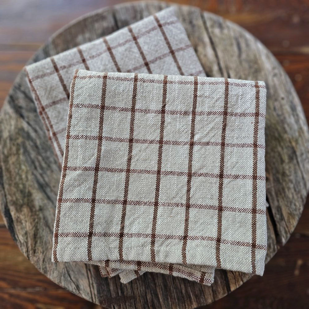 Enhance your kitchen with the Chestnut and Flax Check Kitchen Towel Set, featuring two towels crafted from 100% cotton for softness and durability. The warm chestnut and flax tones in a timeless check pattern bring a refined rustic charm that complements any farmhouse or cottage decor. Practical and easy to maintain, these 20" x 28" towels blend style and everyday functionality seamlessly.