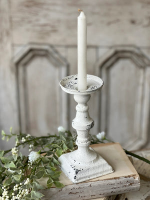 Our Chippy White Tall Taper Candle Holder features romantic curves and an aged, chippy finish for a shabby chic look. They are perfect for adding a bit of antique flair to any tabletop or bedside table. Made of metal with a distressed ivory finish and a nice large plate to catch dripping wax. Holds regular size tapers (not included). Measures 8" high by 4" wide at base.