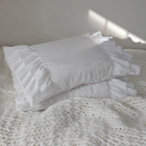 Our Cloud White Double Ruffle Pillowcase Set brings shabby chic and vintage style together to create a dreamy white cottage bedroom. This ultra soft pillowcase set features two layers of snow-white ruffled edges on each ends.

Made of high quality brushed microfiber material, these pillowcases offer you unparalleled softness and comfort. Breathable and skin-friendly, the combination of the unique design, lasting durability and softness will help you sleep well all night.

Machine washable